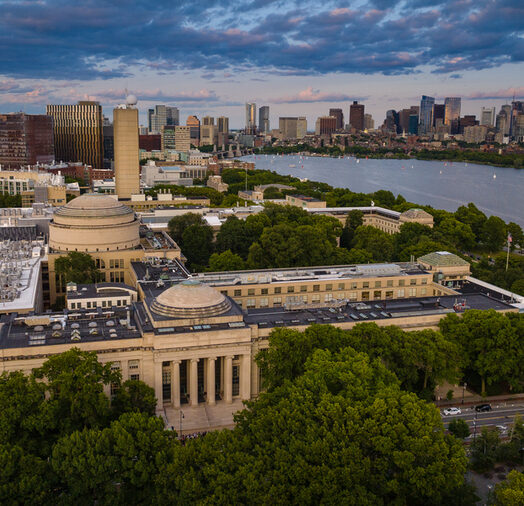 Aerial view of the MIT campus, with the Charles River and Boston in the background
