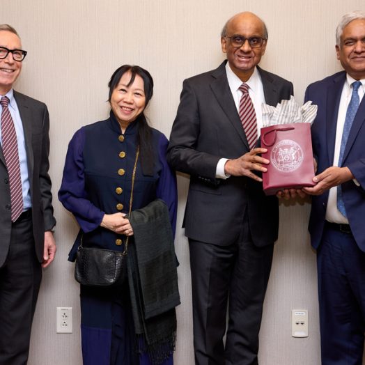 Locke, Tharman, Ittogi, and Chandrakasan stand together and smile.