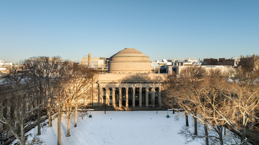 Aerial photo of the MIT Dome and Killian Court with snow on the lawn