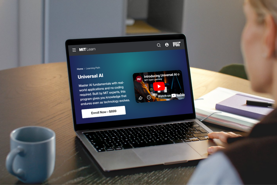 An open laptop with the Universal AI program page on screen.