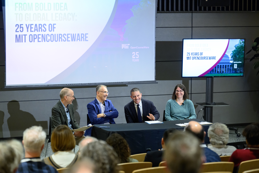 Four people sitting at a table speaking to an audience, with a screen in the background that states, From Bold Idea to Global Legacy: 25 years of MIT OpenCourseWare